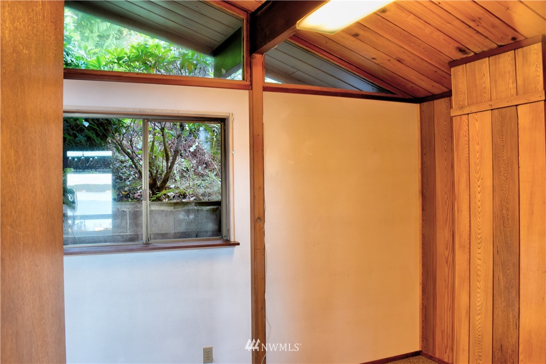 7130 Sandy Point Road Northeast Olympia, WA 98516 - Photo 17 of 32 a view of a glass door with a yard