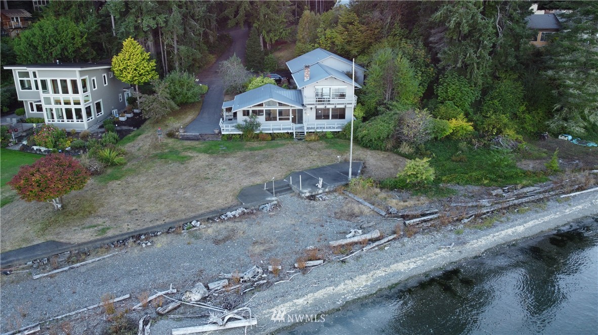 7130 Sandy Point Road Northeast Olympia, WA 98516 - Photo 32 of 32 a front view of a house with garden