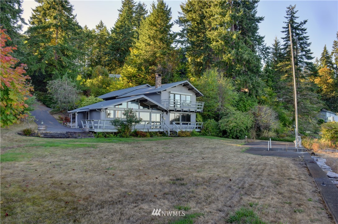 7130 Sandy Point Road Northeast Olympia, WA 98516 - Photo 5 of 32 a view of a house with a yard