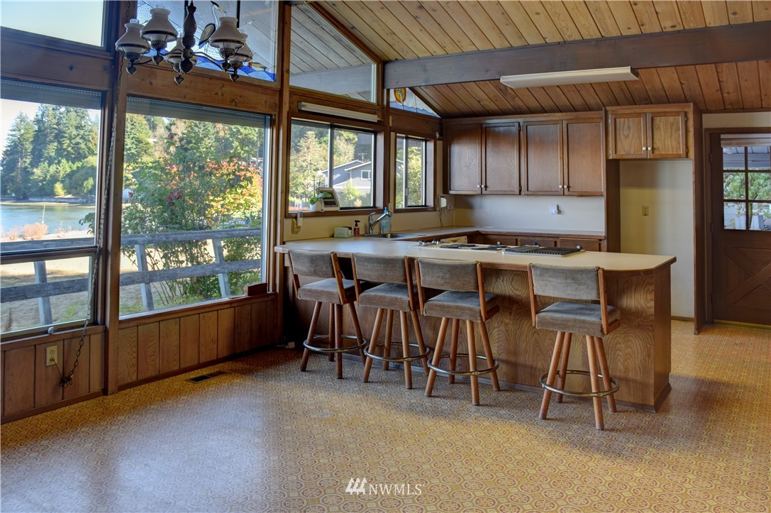 7130 Sandy Point Road Northeast Olympia, WA 98516 - Photo 7 of 32 a view of a dining room with furniture window and outside view