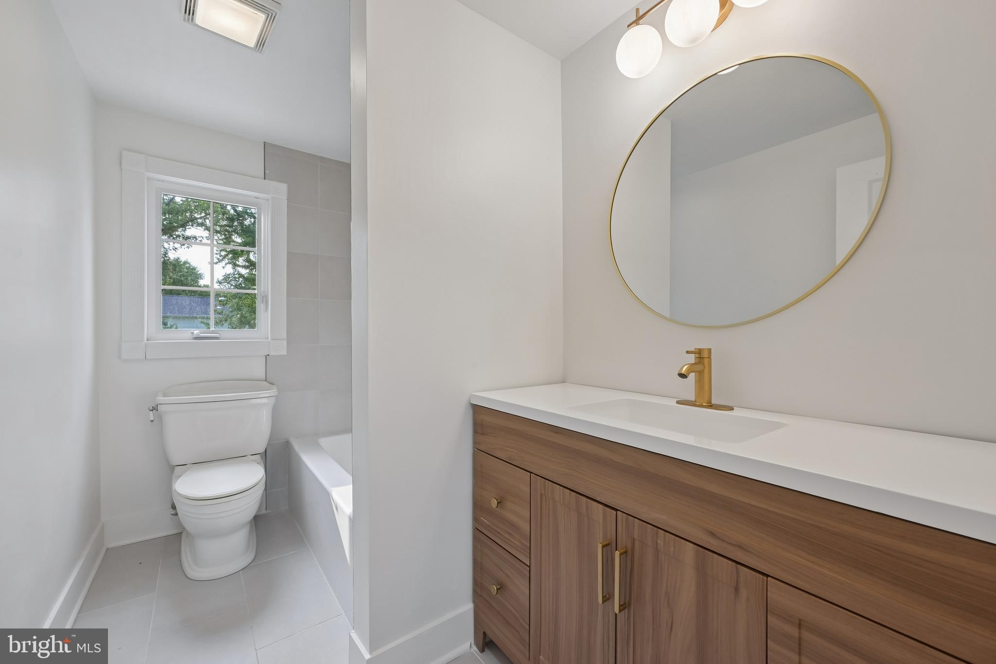 3 Kennington Road Marlton, NJ 08053 - Photo 23 of 24 a bathroom with a granite countertop toilet a sink and a mirror