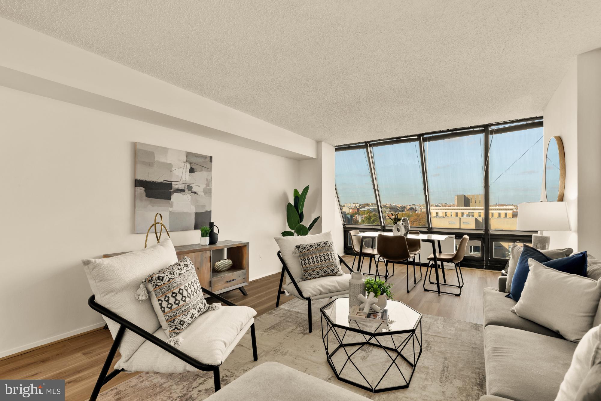 1245 13th Street Northwest, Unit 907 Washington, DC 20005 - Photo 2 of 27 a living room with furniture and a large window