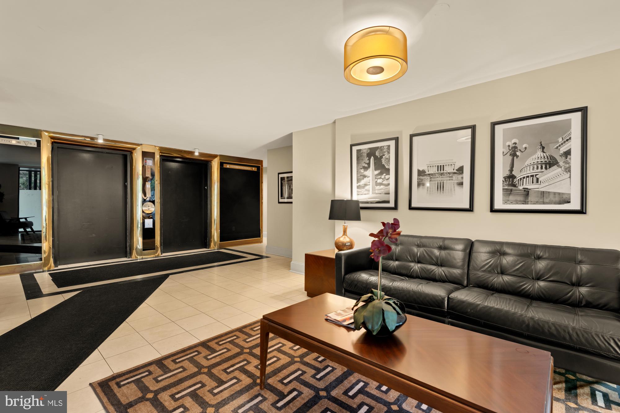 1245 13th Street Northwest, Unit 907 Washington, DC 20005 - Photo 21 of 27 a living room with furniture and a flat screen tv