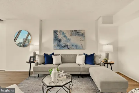 a living room with furniture and a lamp