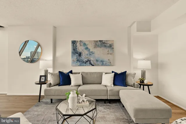 a living room with furniture and a lamp