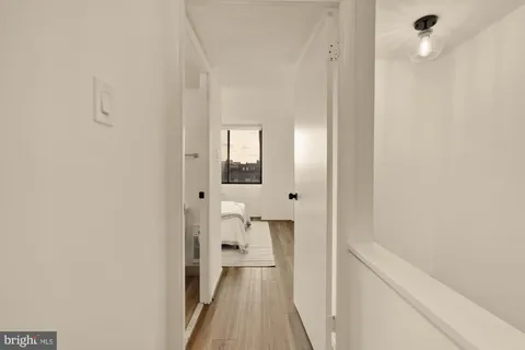 a view of a bathroom from a hallway