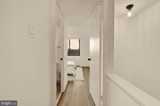 a view of a bathroom from a hallway