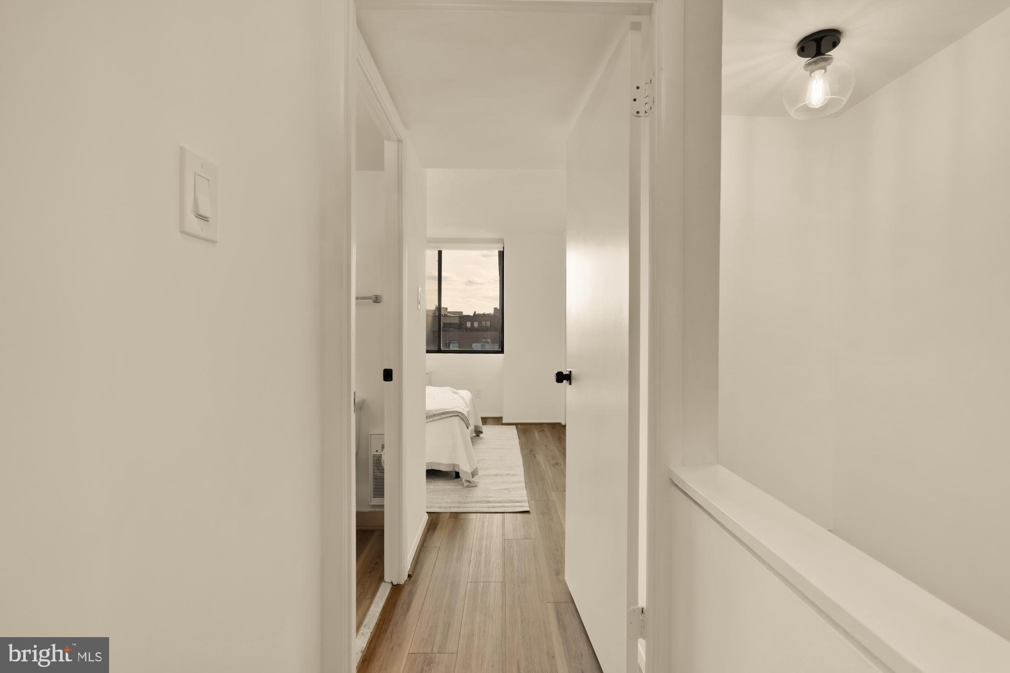 1245 13th Street Northwest, Unit 907 Washington, DC 20005 - Photo 8 of 27 a view of a bathroom from a hallway