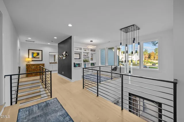 a bathroom with a shower sink vanity mirror and toilet