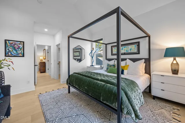 a living room with furniture a rug and a large window