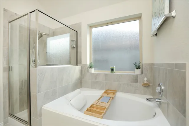 a bathroom with a bathtub and a sink
