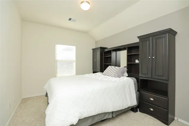 a bedroom with a bed and a closet