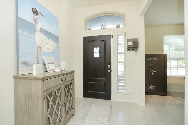 hallway with mirror and furniture