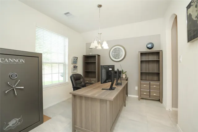 a view of a kitchen with a window and a clock