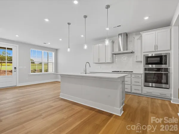 a kitchen with counter top space cabinets and appliances