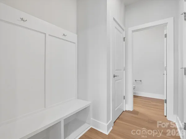 a view of entryway with wooden floor