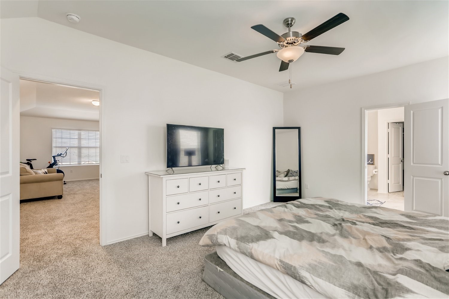 3901 Fort Collins Way Austin, TX 78744 - Photo 13 of 26 a bedroom with a bed a large window and dresser