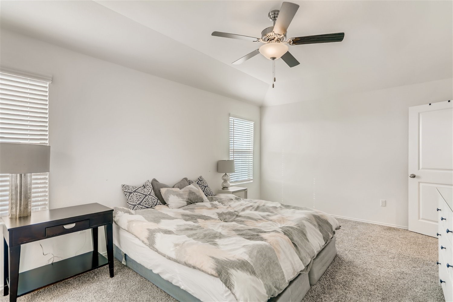 3901 Fort Collins Way Austin, TX 78744 - Photo 14 of 26 a bedroom with a bed and a ceiling fan