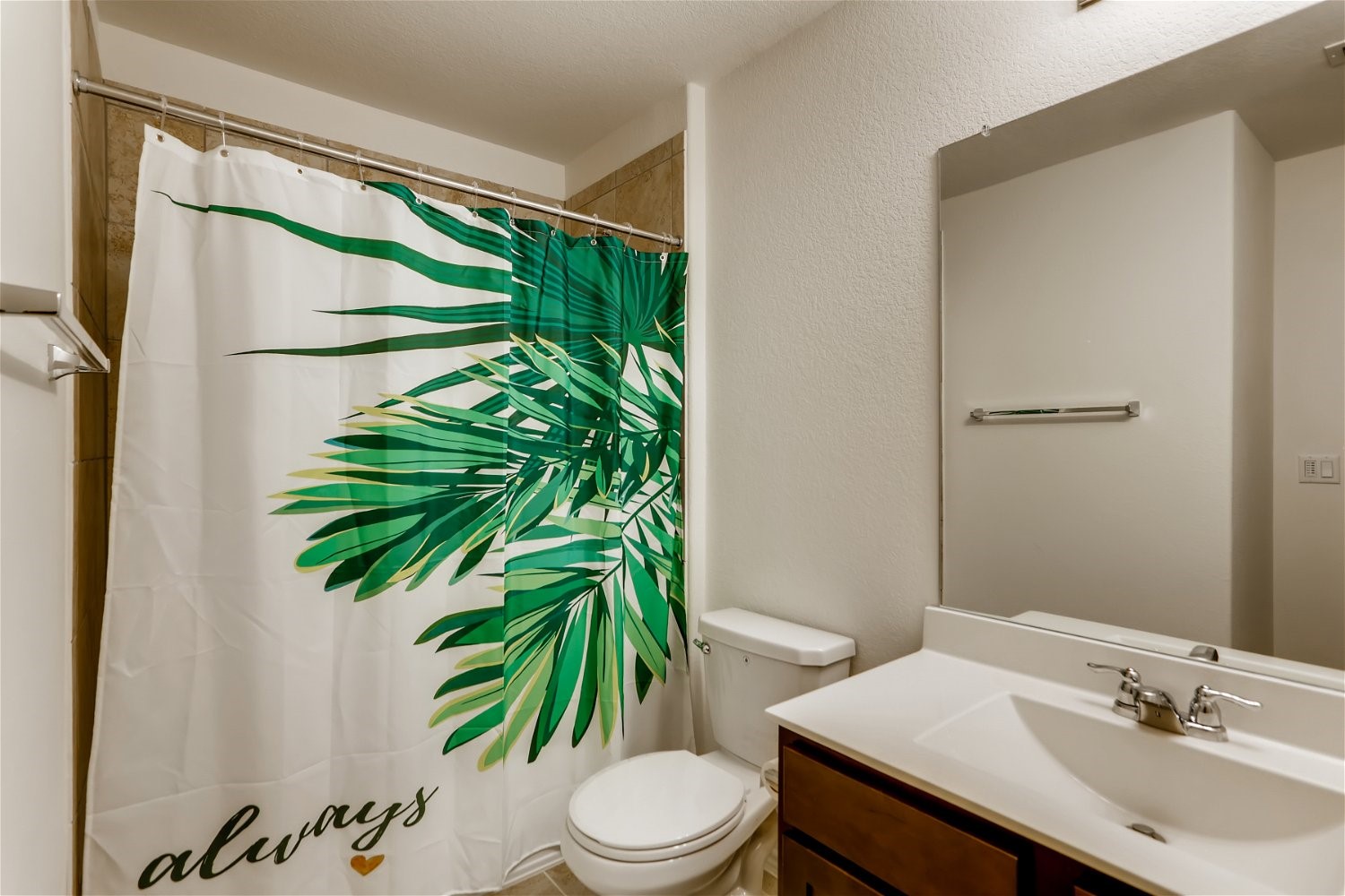 3901 Fort Collins Way Austin, TX 78744 - Photo 20 of 26 a bathroom with a sink a toilet and a mirror
