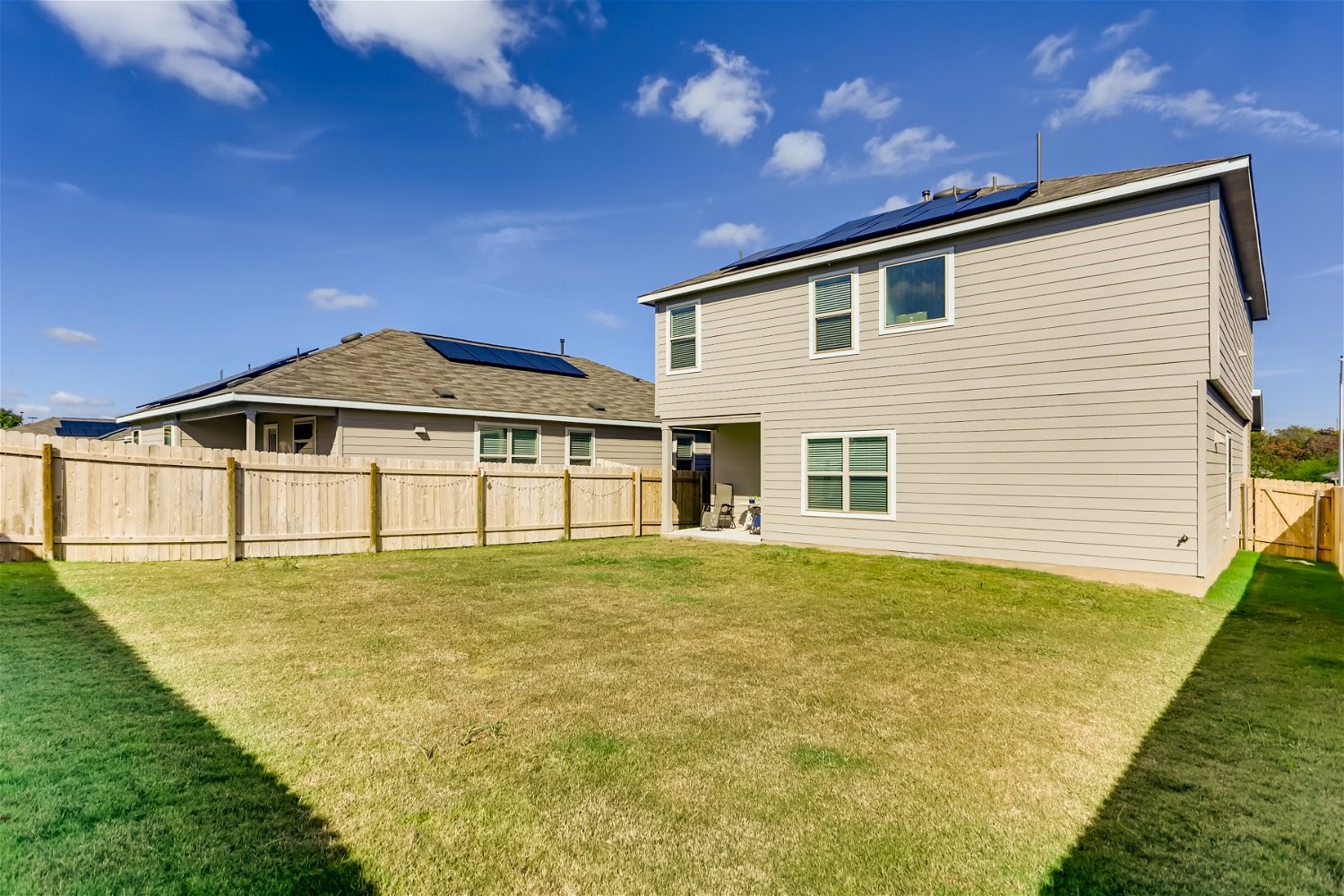 3901 Fort Collins Way Austin, TX 78744 - Photo 25 of 26 a front view of a house with a yard