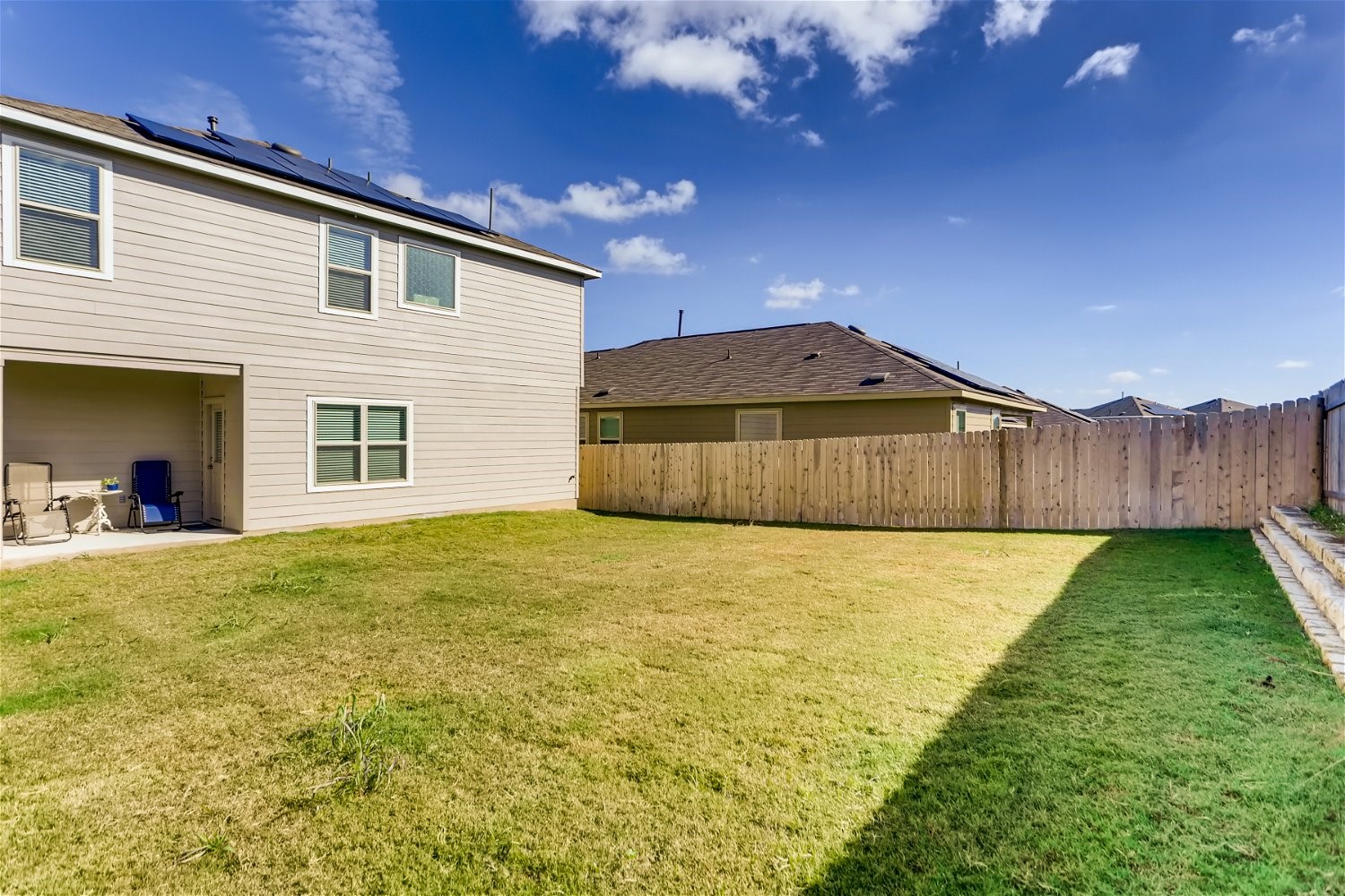 3901 Fort Collins Way Austin, TX 78744 - Photo 26 of 26 a view of an house with backyard space and wooden fence