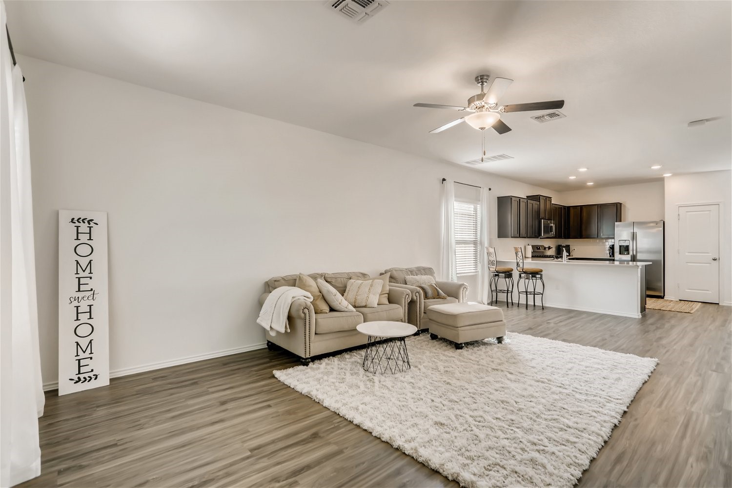3901 Fort Collins Way Austin, TX 78744 - Photo 4 of 26 a living room with furniture and kitchen view
