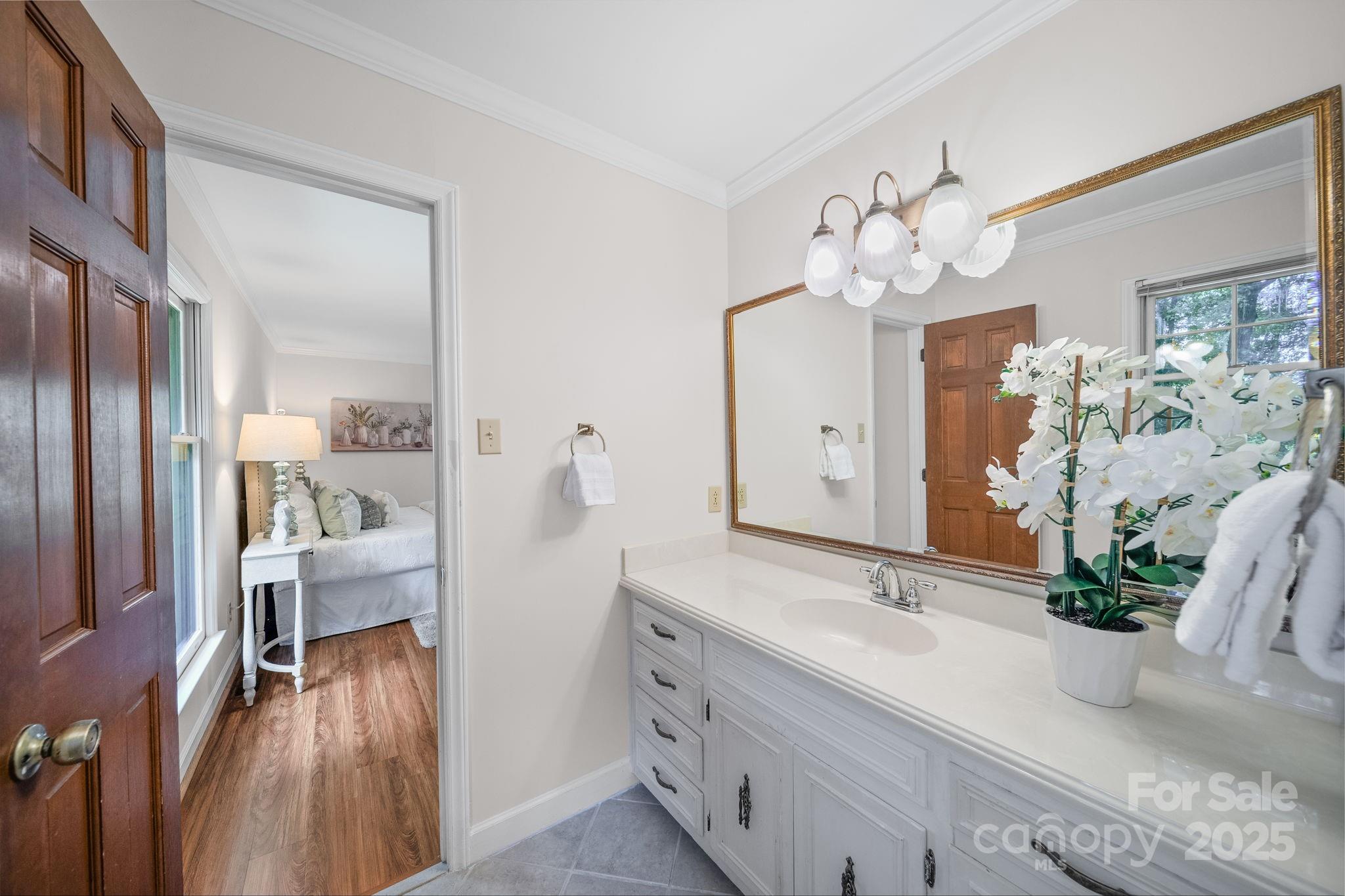 1676 Partridge Circle Lancaster, SC 29720 - Photo 19 of 43 a spacious en suite bathroom with a double vanity sink and a mirror