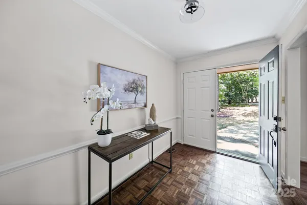 a living room with a bed furniture and a window