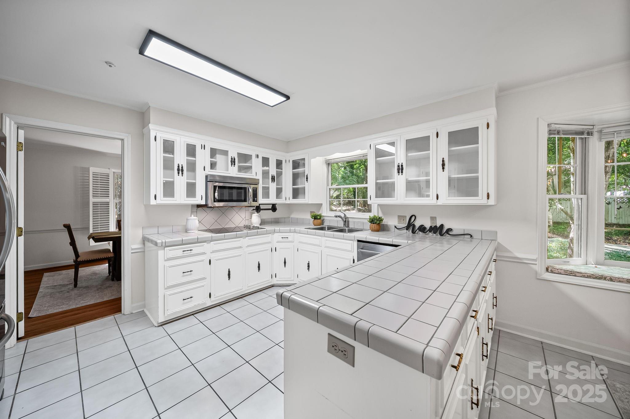 1676 Partridge Circle Lancaster, SC 29720 - Photo 10 of 43 a large white kitchen with cabinets