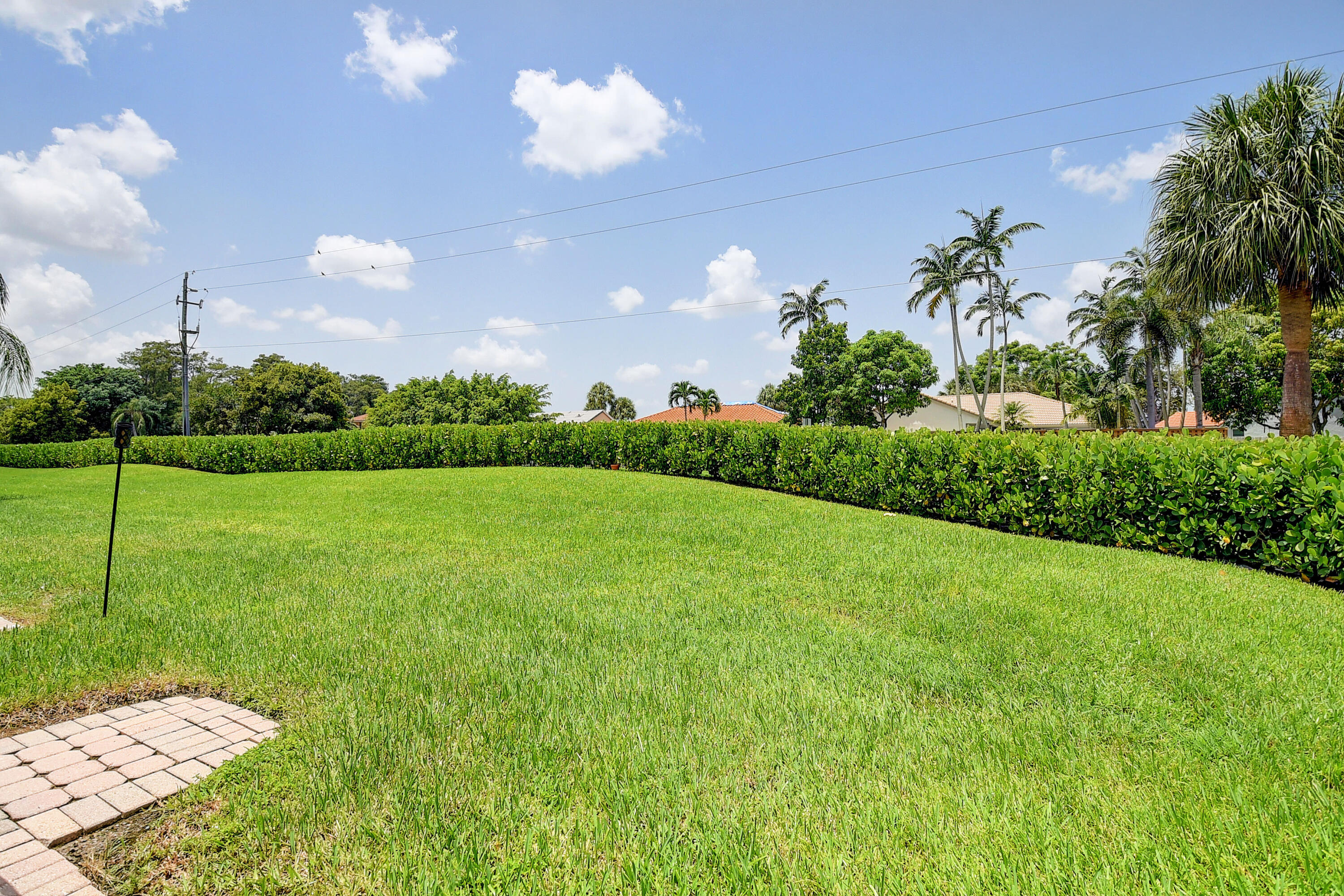 9518 Boca River Circle Boca Raton, FL 33434 - Photo 17 of 34 a view of a big yard with potted plants