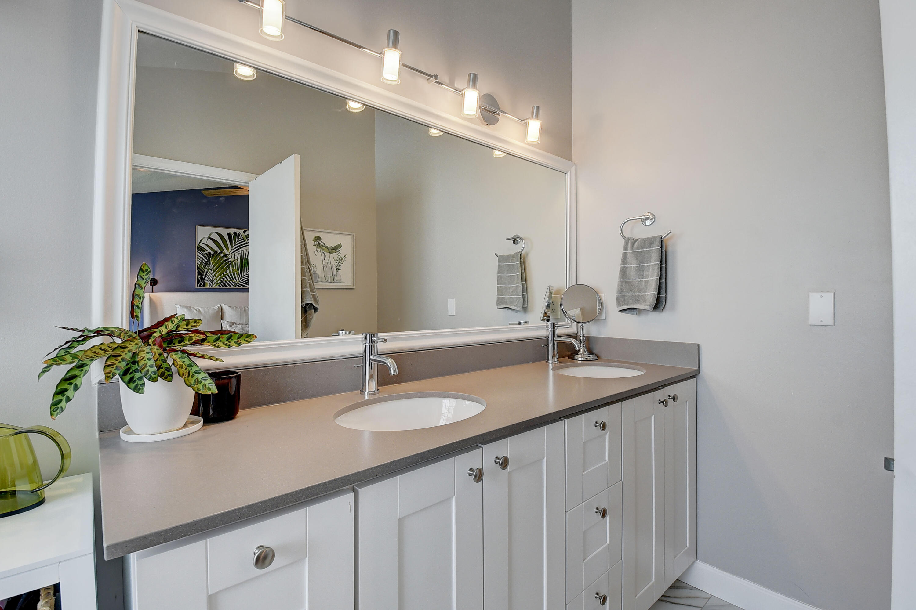 9518 Boca River Circle Boca Raton, FL 33434 - Photo 24 of 34 a bathroom with double vanity sinks a vanity and a mirror