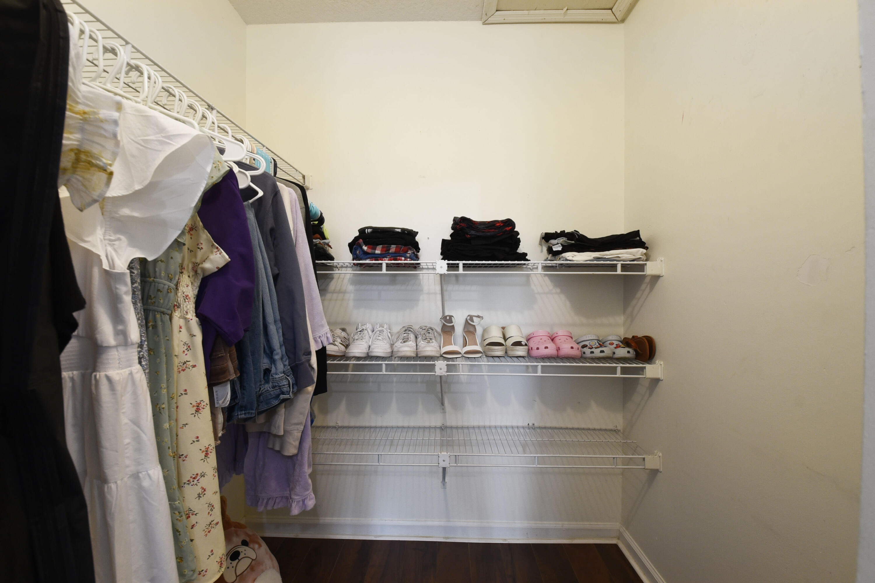9518 Boca River Circle Boca Raton, FL 33434 - Photo 29 of 34 a view of walk in closet with clothes and shoes