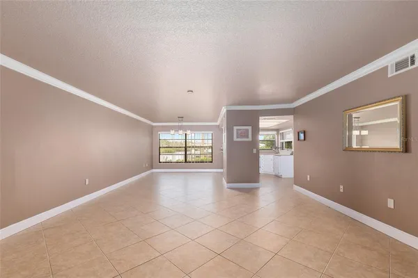 a view of livingroom with hardwood floor and kitchen view