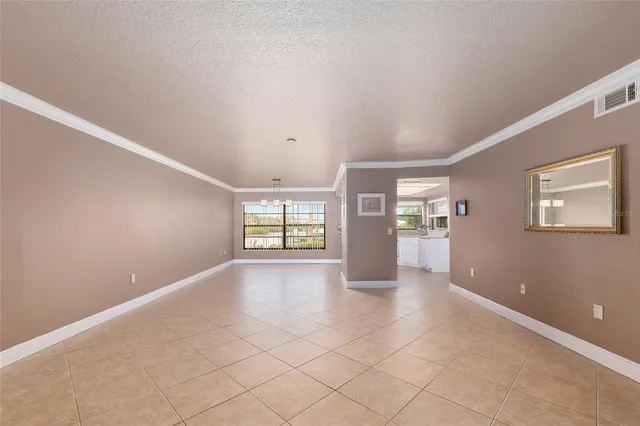 a view of livingroom with hardwood floor and kitchen view