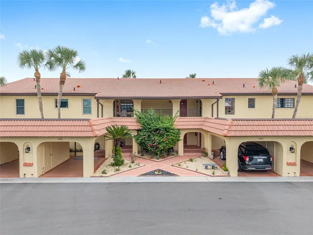 a view of a car park in front of house