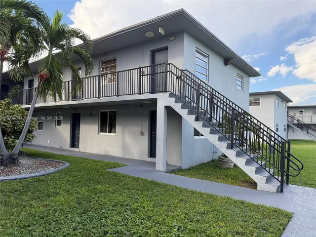 a view of house with yard and entertaining space