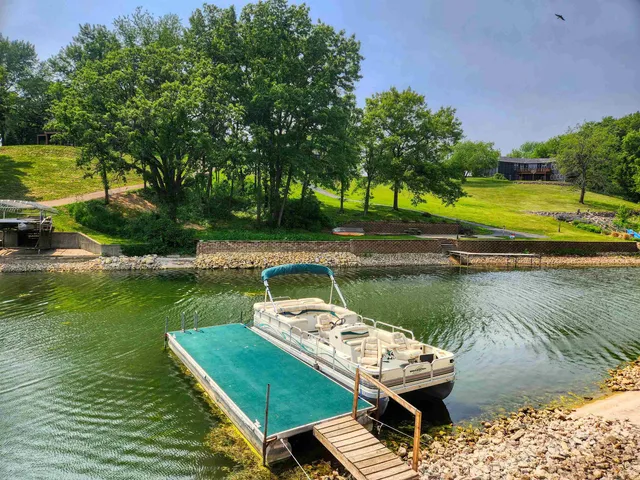 a view of a lake with a house in the background