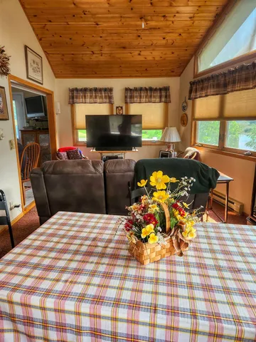 a living room with furniture fireplace and flat screen tv