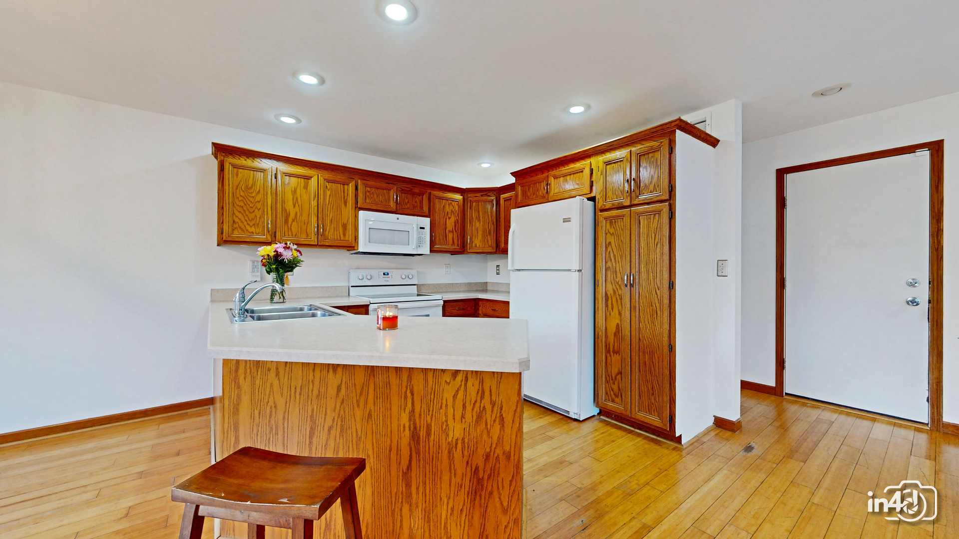 502 West 4th Street Sandwich, IL 60548 - Photo 8 of 33 a kitchen with stainless steel appliances a refrigerator and a stove top oven