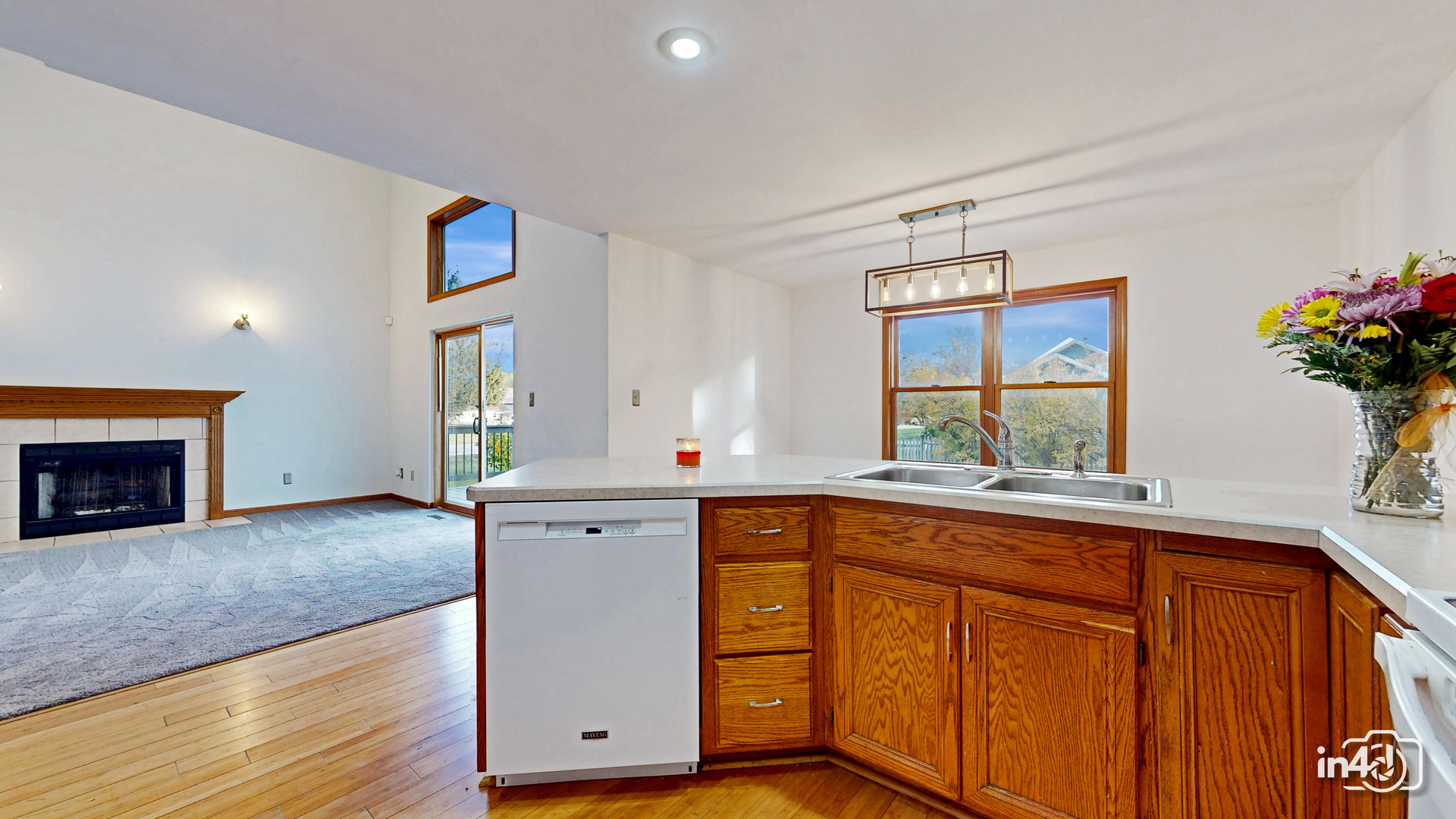502 West 4th Street Sandwich, IL 60548 - Photo 9 of 33 a view of cabinets a kitchen island wooden floor and a window