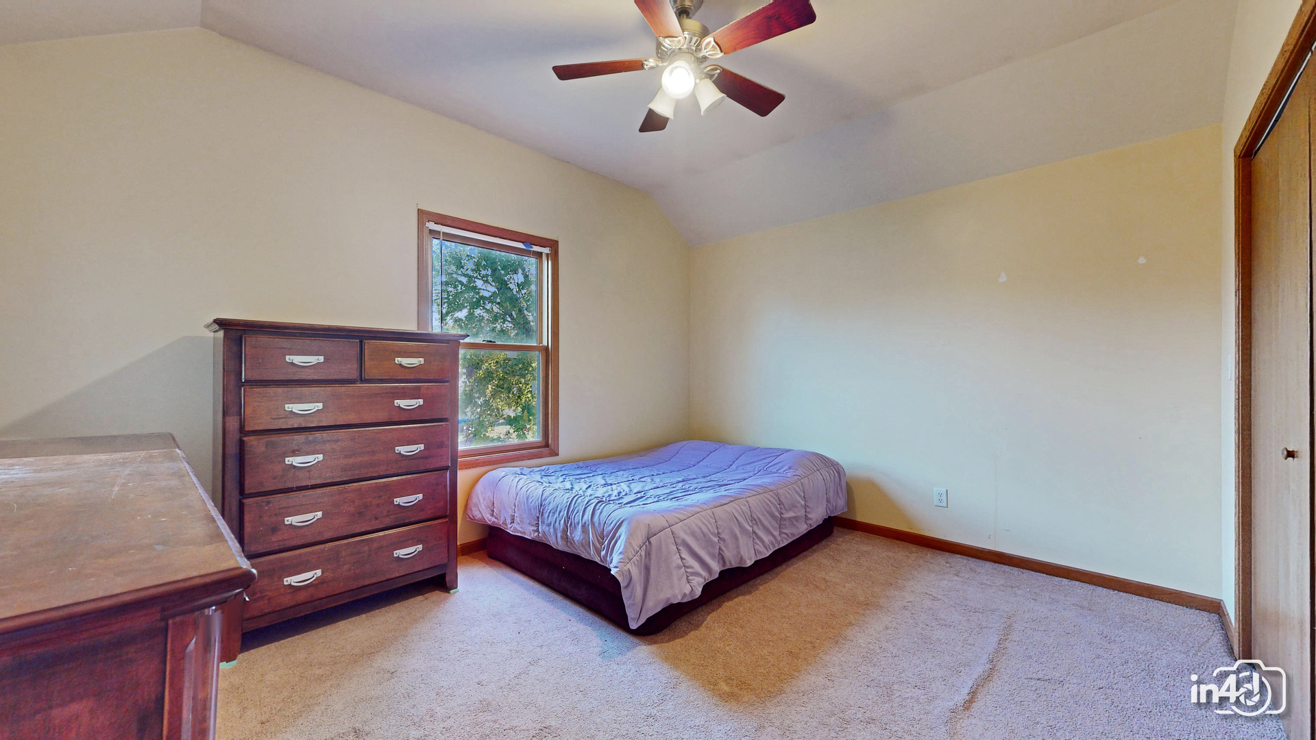 502 West 4th Street Sandwich, IL 60548 - Photo 13 of 33 a bedroom with a bed and a dresser