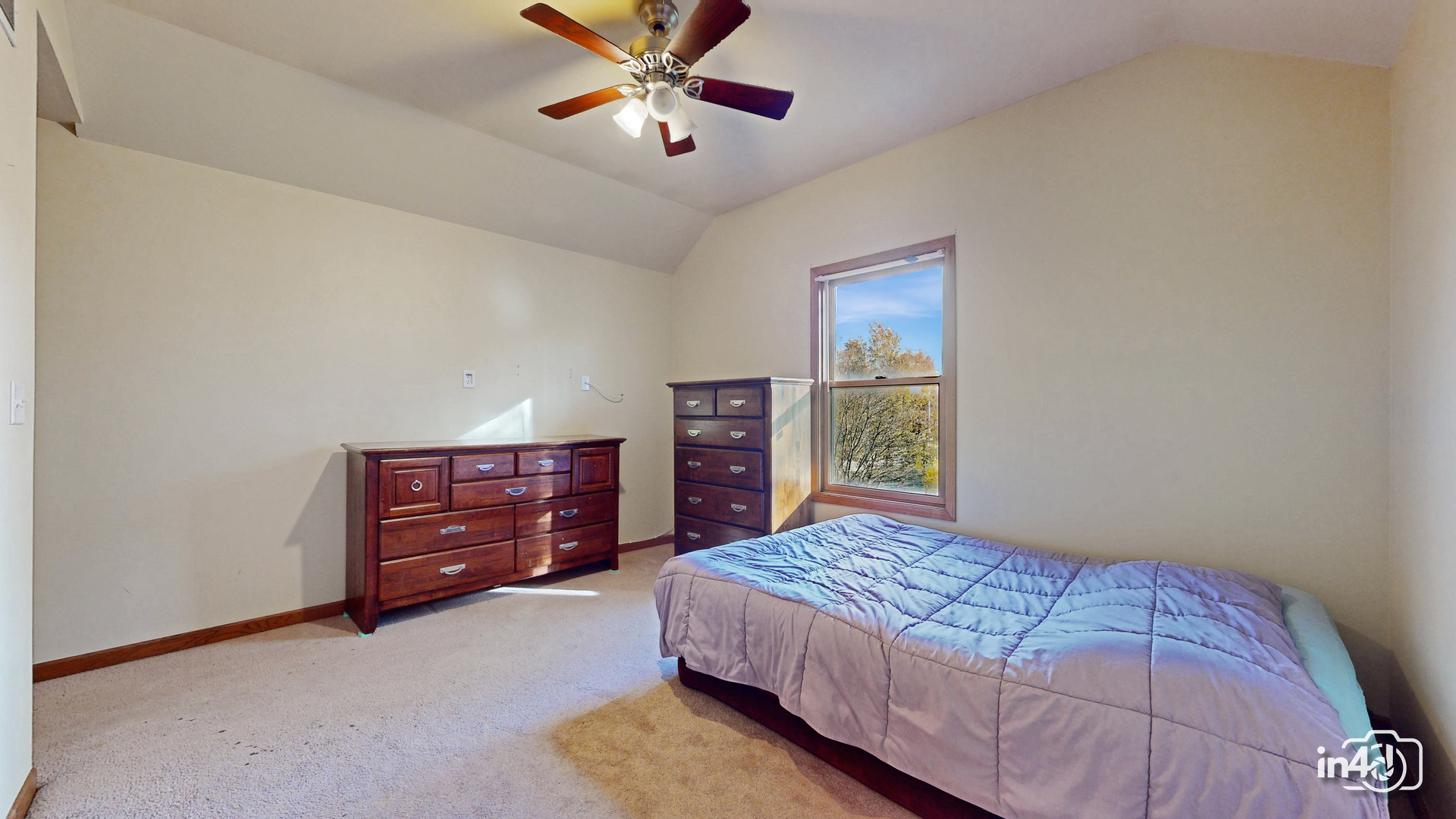 502 West 4th Street Sandwich, IL 60548 - Photo 14 of 33 a bedroom with a bed and a chandelier