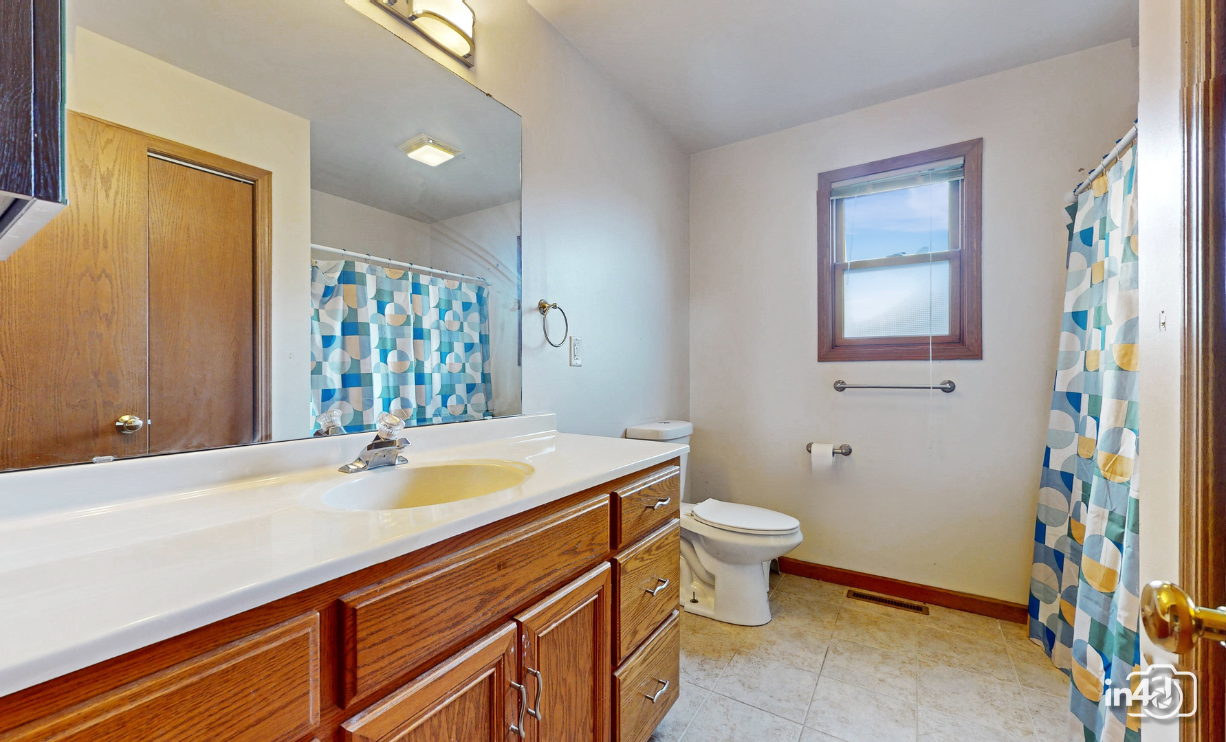 502 West 4th Street Sandwich, IL 60548 - Photo 15 of 33 a bathroom with a sink toilet and a mirror