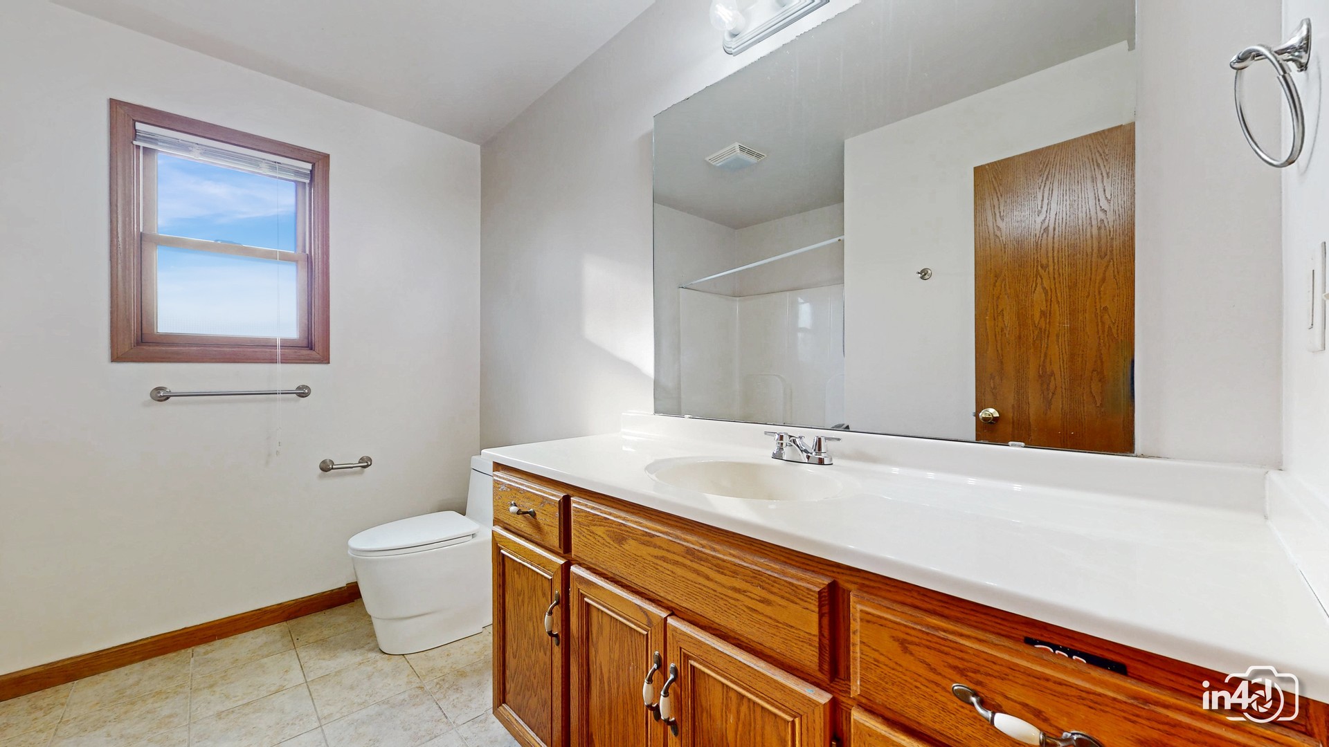 502 West 4th Street Sandwich, IL 60548 - Photo 19 of 33 a bathroom with a granite countertop sink and a mirror