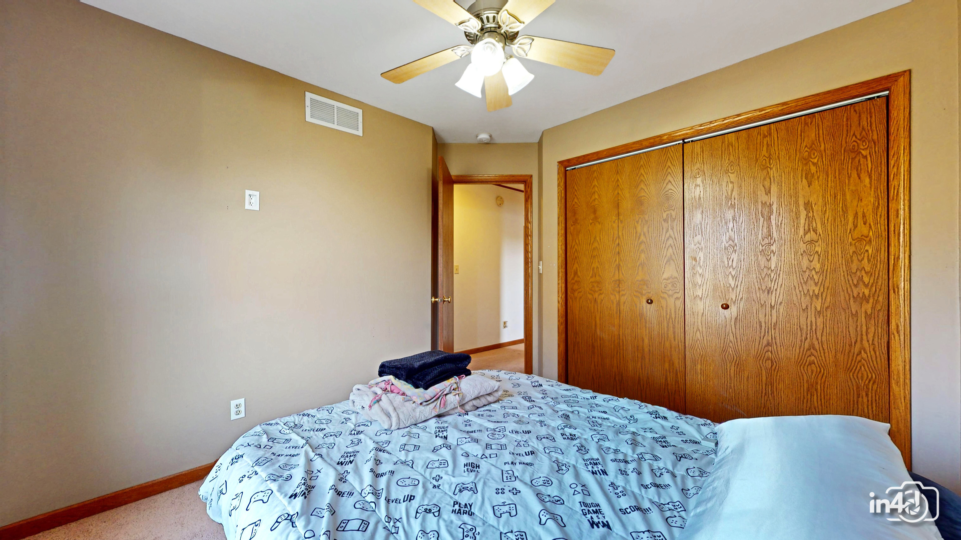 502 West 4th Street Sandwich, IL 60548 - Photo 22 of 33 a bedroom with a bed and a chandelier