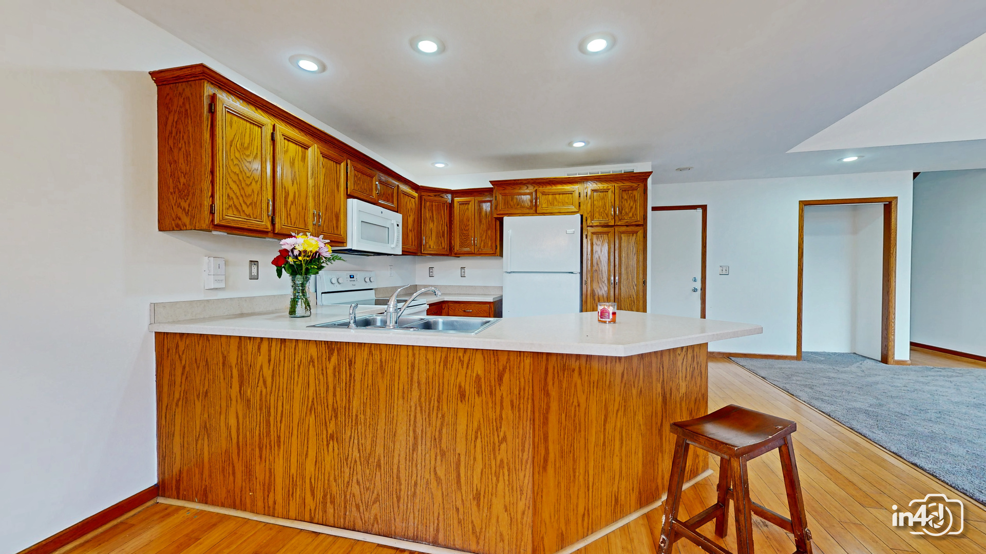 502 West 4th Street Sandwich, IL 60548 - Photo 7 of 33 a kitchen with stainless steel appliances granite countertop a sink and cabinets