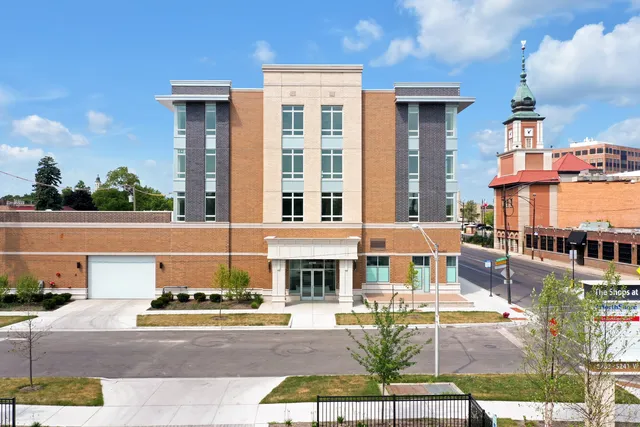 a front view of a building with street view