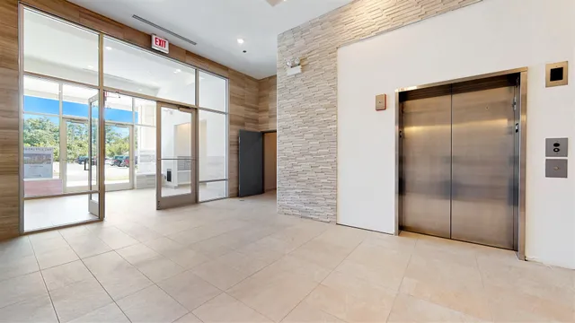a view of an empty room with a sliding door