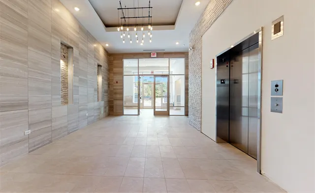 a view of entryway with a chandelier