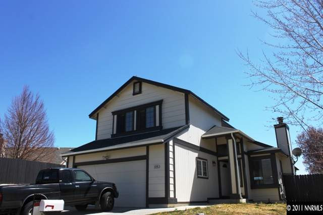 a front view of a house with parking
